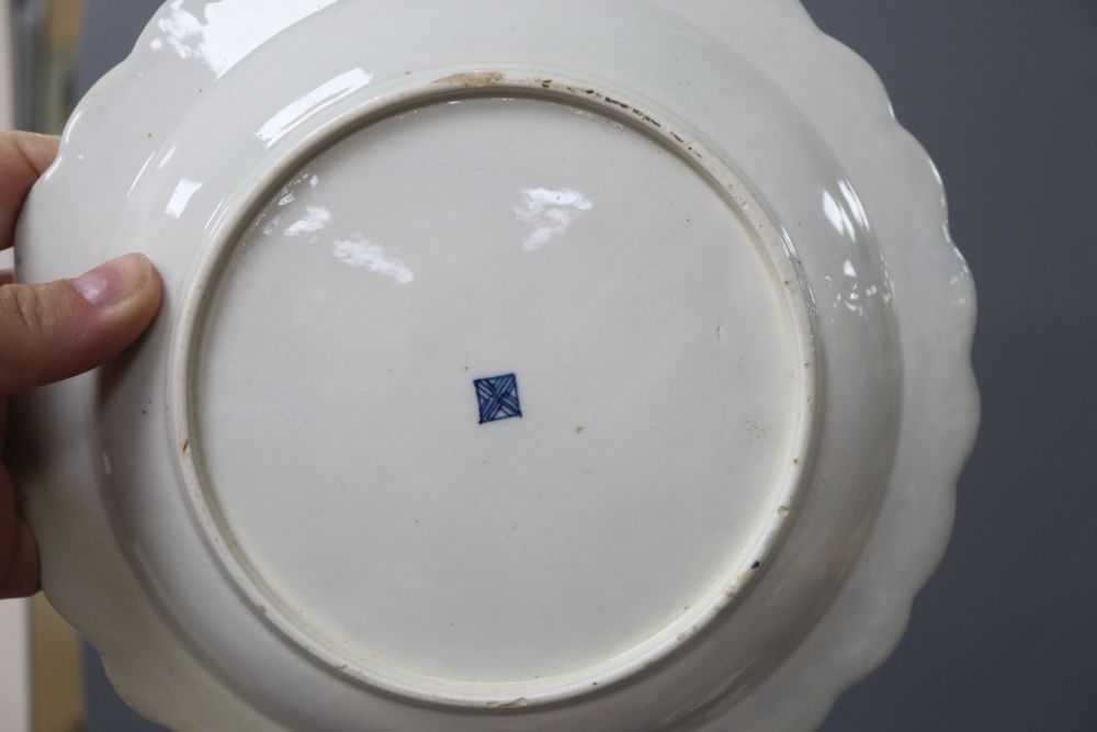 An 18th century Worcester blue scale plate, diameter 19.5cm and a sauceboat